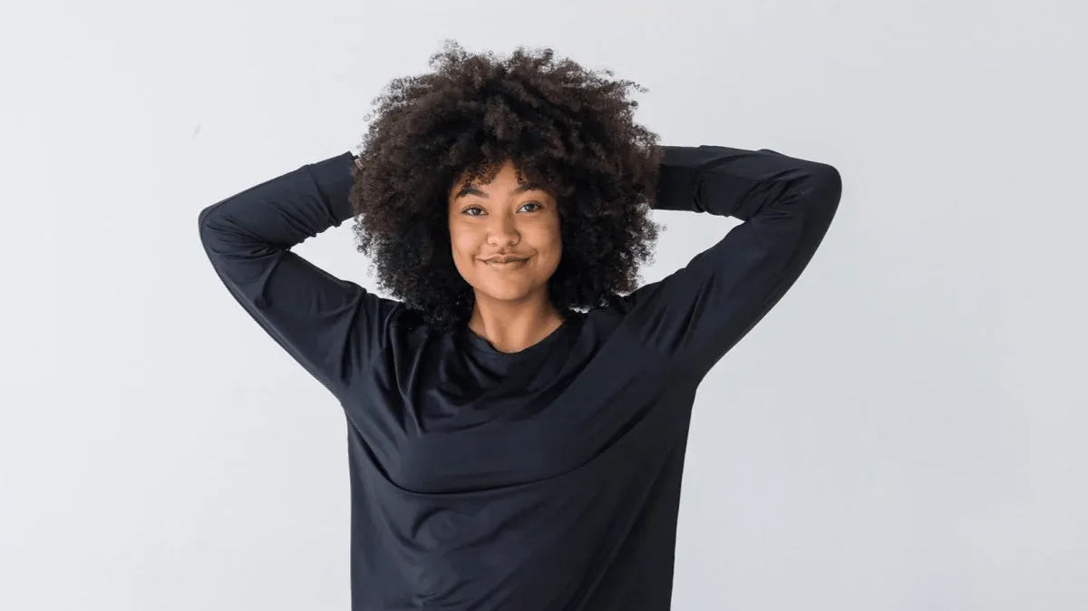 Woman smiling wearing Laser Cut Pullover - Black